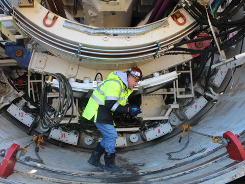 D.C. Clean Rivers Project manager Carlton Ray, explaining how the tunnel boring machines work. The machine he is walking on is named Nannie, for 20th century African-American educator, civil rights activist, and D.C. resident Nannie Helen Burroughs. Credit: Randy Showstack