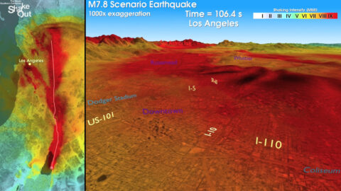 A screen shot of earthquake rupture during the ShakeOut simulation, showing a view of southern California with the seismic waves radiating outward from the San Andreas fault as the rupture propagates toward the northwest. Warmer colors indicate stronger shaking. To view the full movie along with animated simulations of shaking from neighborhood perspectives, click here. Credit: USGS