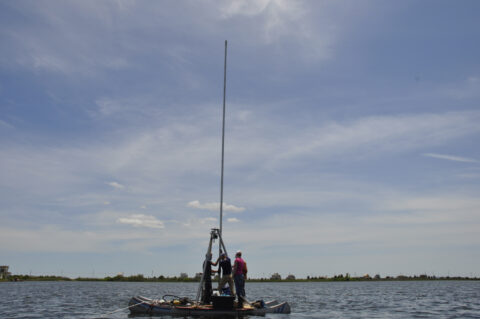 Scientists taking cores from Massachusetts’ Salt Pond. The core recovered provides evidence of intense storm events going back approximately 2000 years. Credit: Richard Sullivan, WHOI