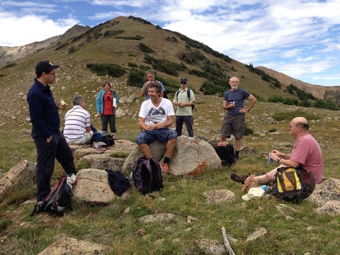 Scientists rest midway through a group hike during one day of a seismic hazards assessment workshop in the Colorado Rockies. The workshop used hiking as a way to foster a sense of camaraderie and create long, unguarded discussions among the hikers, despite heated debate around the workshop table. Credit: Ross S. Stein