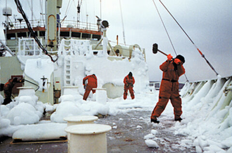 Scientists and crew members knock ice off the deck of the R/V Knorr during a research expedition in the Laborador Sea. Credit: George Tupper, WHOI