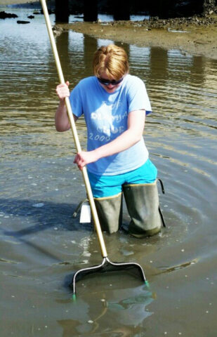 Marine scientist Charlotte Eckmann, collects grass shrimp from an estuary. Credit: Charlotte Eckmann