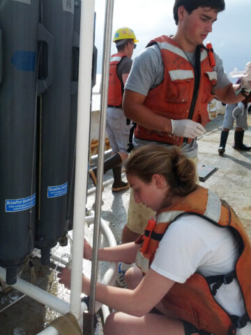 Alexander Weinstein and Arielle Green, students in John Kessler’s research group, collect water samples from Hudson Canyon aboard the R/V Endeavor in July 2014. Credit: John Kessler