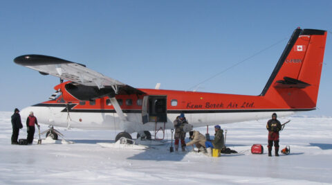 Researchers use aircraft on skies to sample the ocean beneath the ice. Credit: Eddy Carmack