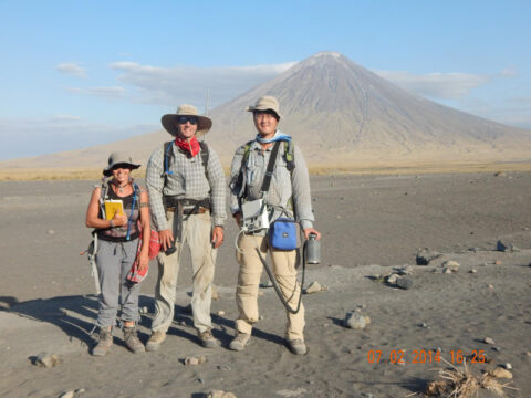 A recent study by these scientists identified a new, natural source of carbon dioxide emissions into the atmosphere—a region in Africa where the splitting apart of the continental crust opens many fractures in the Earth that release the gas. The research team includes master’s student Nicole Thomas, Professor Tobias Fischer, and Ph.D. student Hyunwoo Lee, from the University of New Mexico. Northern Tanzania’s Oldoinyo Lengai volcano looms in the background. Credit: University of New Mexico