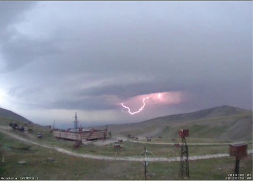 An instrument in the sensor network at Aragats Space Environmental Center captured this photo, which shows intracloud lightning below the network. Because the instrument station is located 3200 meters above sea level, clouds sometimes sit on or below the station. Credit: Cosmic Ray Division, Yerevan Physics Institute