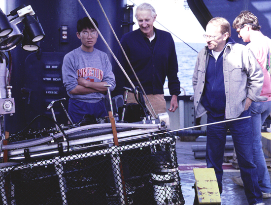 Dick and colleagues standing near Alvin’s basket of instruments.