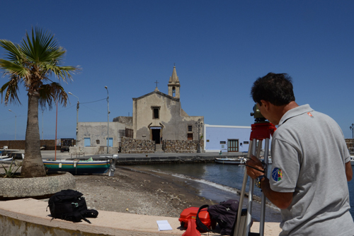 Scientists measure land subsidence effects on Lipari’s coast.