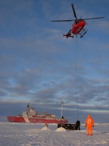 A box with deployment gear is slung back to the ship after installation of an Ice-Based Observatory during an expedition to the Beaufort Gyre region in 2010. Credit: Richard Krishfield, Woods Hole Oceanographic Institution