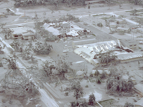 Aerial view of part of Clark Air Base on 24 June 1991 showing buildings and vegetation damaged by Mount Pinatubo’s 15 June 1991 eruption.