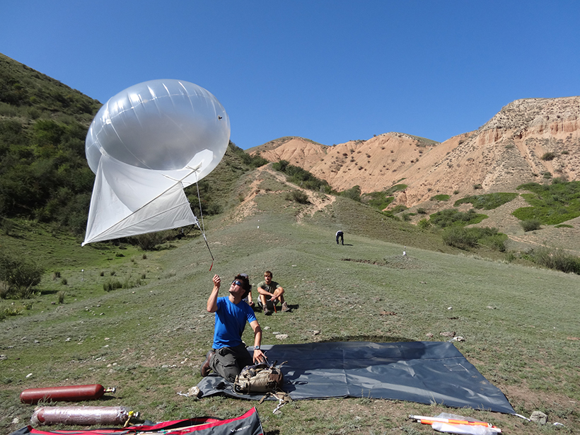 David Mackenzie with a balloon and a camera to survey 1889 earthquake ruptures.