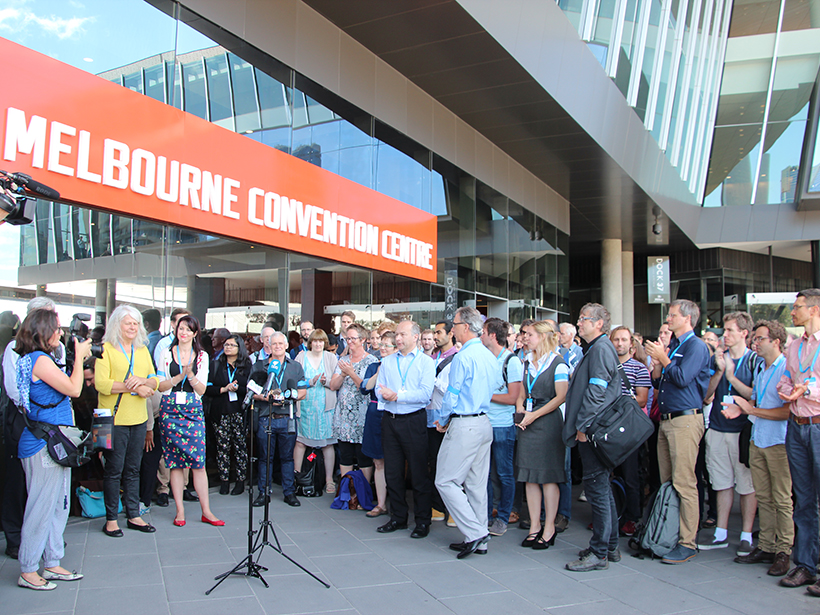 Climate scientists attending a climate science conference in Melbourne staged a lunchtime protest over restructuring and cuts to CSIRO staff and climate research programs.