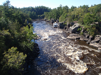 Exposures of the Midcontinent Rift’s 1.1-billion-year-old volcanic rocks along the border between Minnesota and Wisconsin, where the St. Croix river cuts through a series of lava flows.