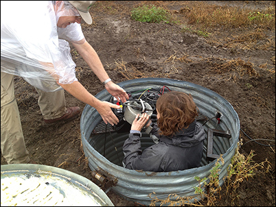 Kansas Geological Survey scientists install a seismograph to monitor induced seismicity in their state