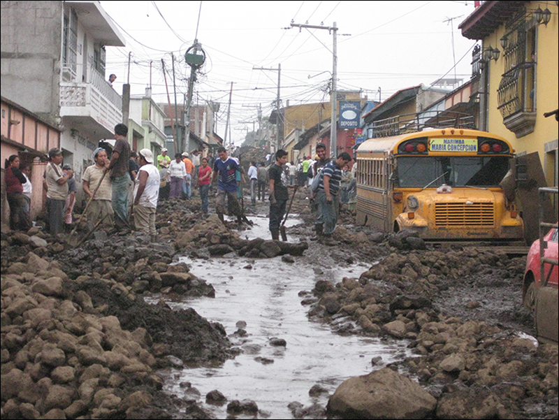 Residents clear landslide debris from the Old Town section of San Miguel Escobar, Guatemala, after Hurricane Agatha.