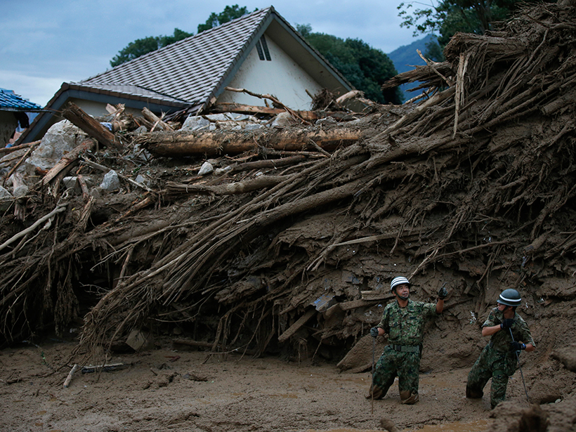 Soldiers search for survivors following rainfall-triggered landslides in Hiroshima, Japan, on 20 August 2014.