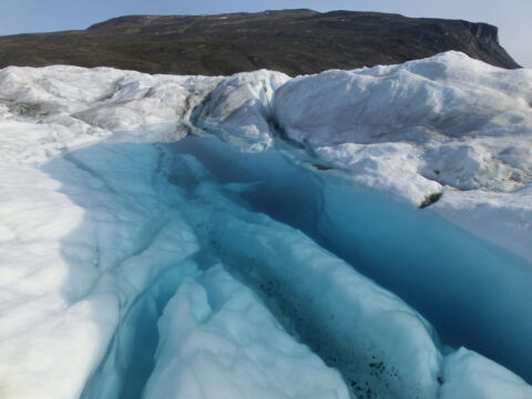 Water-filled crevasse near the calving front of Bowdoin Glacier, northwest Greenland (July 2015). Credit: Evgeny Podolskiy