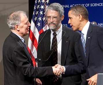 Ralph Cicerone (left) shaking hands with President Barack Obama. White House science adviser John Holdren is in the center.