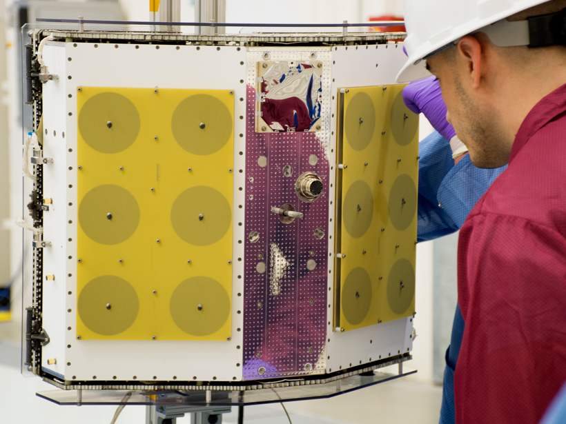 Technicians at Vandenberg Air Force Base in California inspect one of eight CYGNSS spacecraft on 11 October.