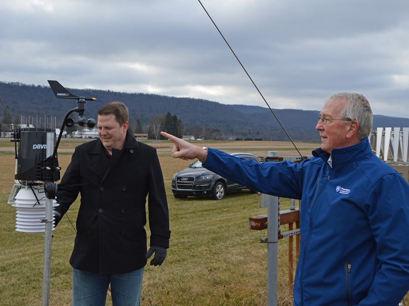 William Easterling and a colleague at a weather station.