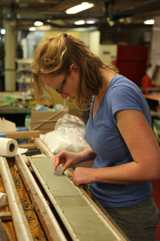 Heather Ford examines a sediment core. How will gender bias affect her scientific career?