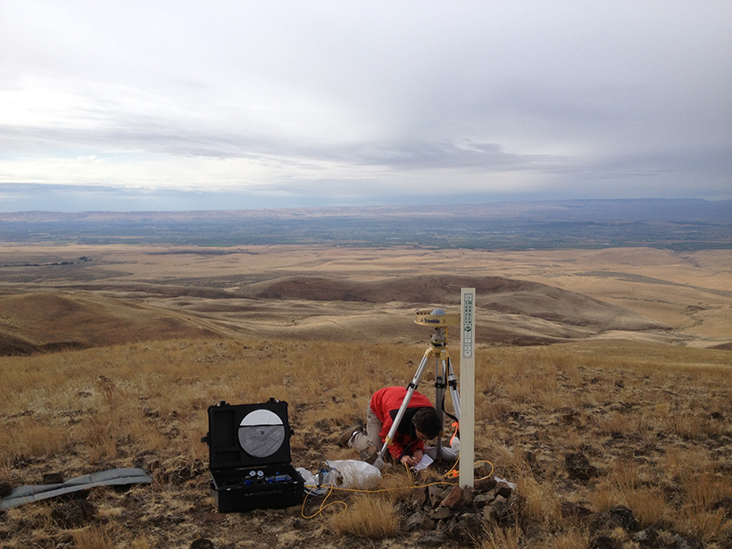 Matt Lancaster sets up a GPS receiver.