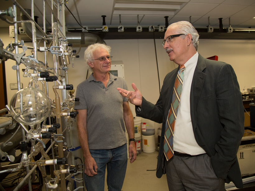 UCAR President Tony Busalacchi (right) tours one of NCAR’s atmospheric chemistry labs.