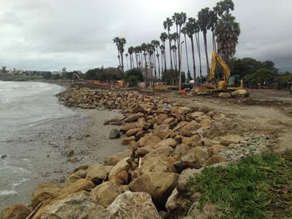 Installing large boulders as rip rap to armor the shore against further erosion at Goleta Beach in Southern California.