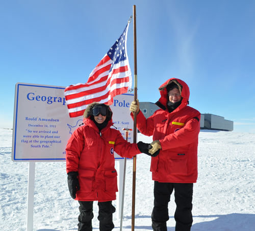 Córdova (left) is shaking hands with Committee chair Rep. Lamar Smith (R-Tx.) at the geographic South Pole during a 2014 congressional delegation visit to Antarctica.