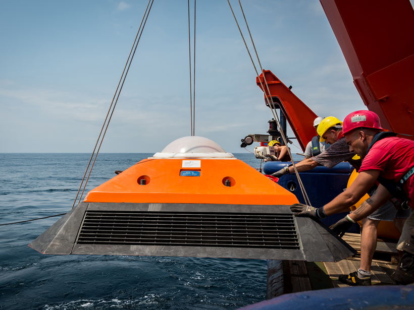 Ship’s crew and technical staff deploy a current meter to monitor Angola Current flow.