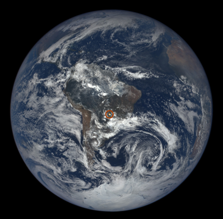 An image from the EPIC instrument aboard DSCOVR, taken on Dec. 3, 2015, shows a glint over central South America (circled in red).
