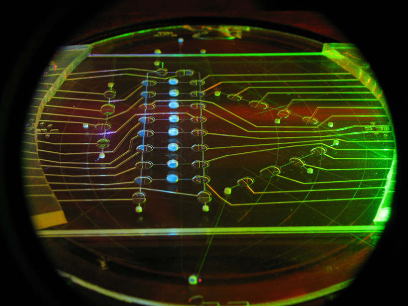 Laser-interrogated microfluidic chip, new planetary instrument technology to search for chemical indicators of life on other worlds.