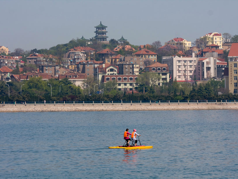 Paddleboaters enjoy a sunny day in Qingdao, China