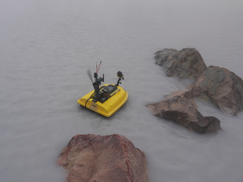 The drone boat speeds off to survey the acid crater lake Laguna Caliente, in Costa Rica’s Poás volcano.