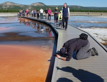 DCO Summer School participants study a hot spring in Yellowstone National Park.