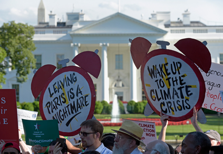 Protesters gathered outside the White House on 1 June to protest Trump’s decision to withdraw the U.S. from the Paris accord.