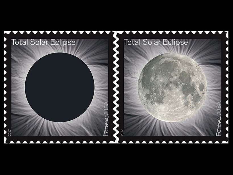 Two views of a new stamp that when warmed by a person’s finger, switches from showing the black disk of the Moon’s silhouette covering the Sun to an illuminated view of the Moon in place of the black disk.