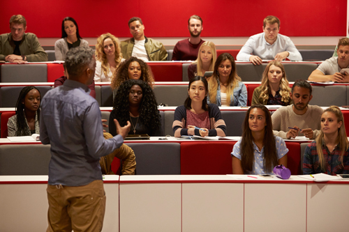 Professor lecturing to university students.