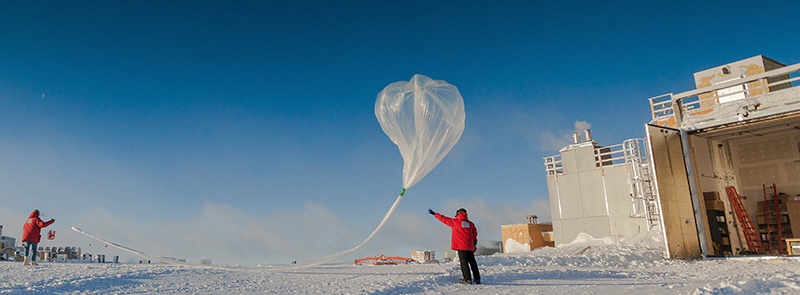 Researchers release a weather balloon carrying an ozone sonde during the 2016 ozone hole research season at the South Pole.