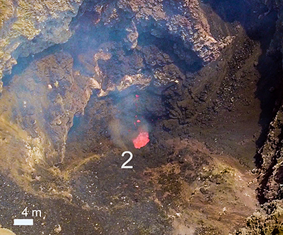 Close-up view of volcanic vent on Stromboli showing weak discontinuous spattering activity that continued between explosions.