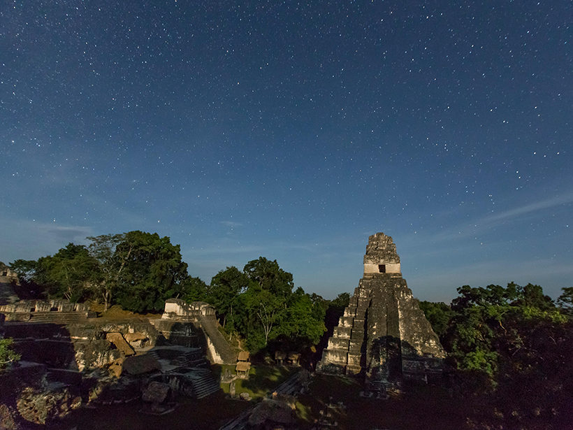 Ruins of the Temple of the Jaguar under the stars.