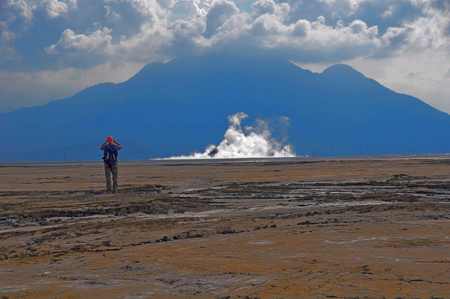 Adriano Mazzini stands on top of dried mud from the Lusi eruption.