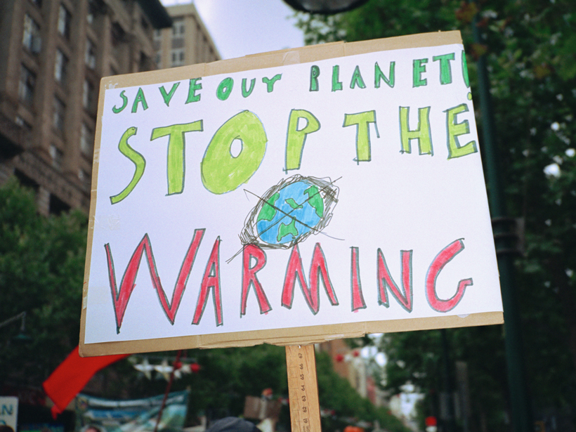 A sign urging action to combat human-induced climate change.