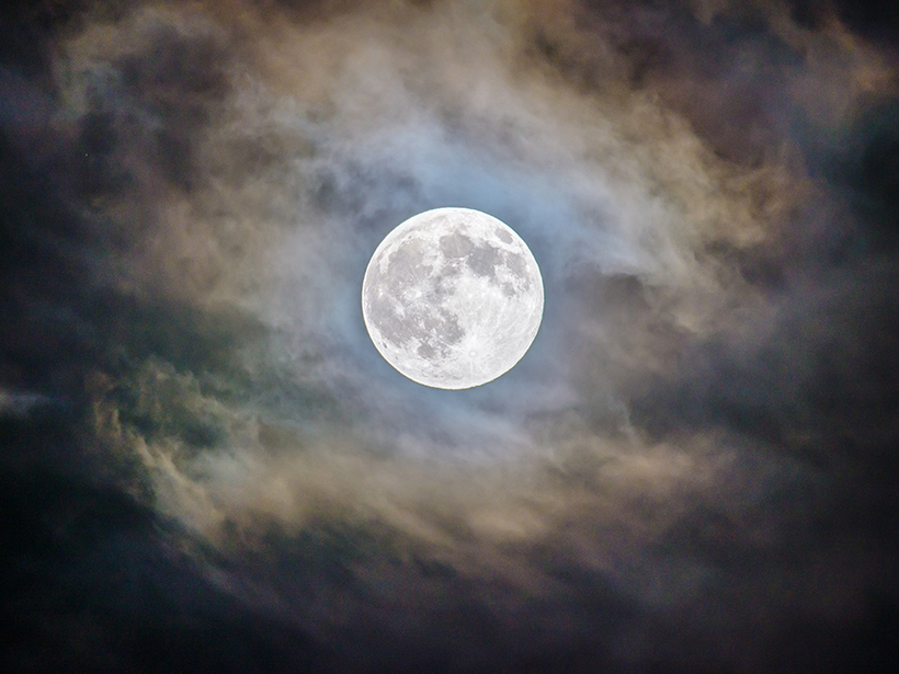 Full moon with clouds over Arizona