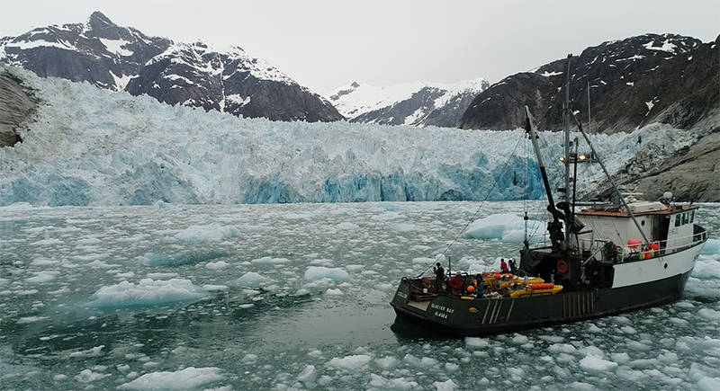 Boat in front of glacier