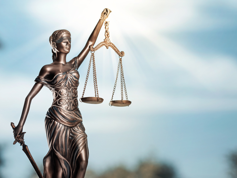 Statue of blind justice holding the scales