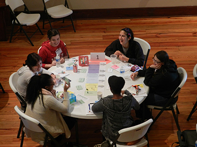 PROGRESS students from the Carolinas play a board game designed to teach the cumulative effects of subtle gender bias.