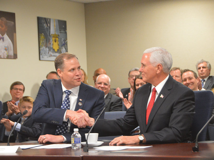New NASA administrator Jim Bridenstine shakes hands with Vice President Mike Pence following Bridenstine’s swearing-in ceremony.
