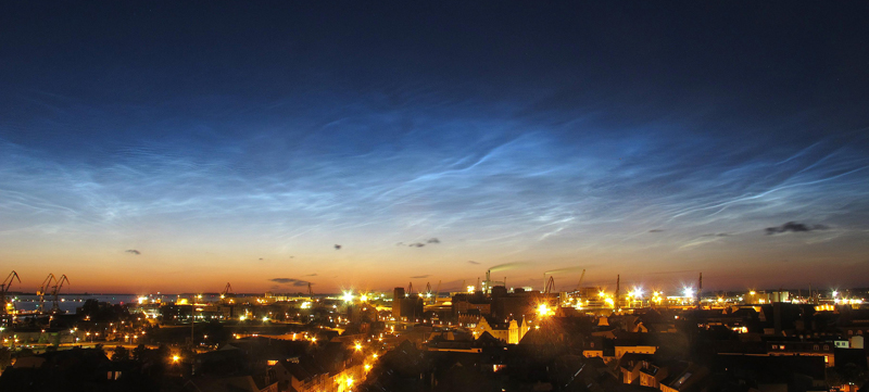 Noctilucent clouds over the city of Wismar, Germany, in July 2015.