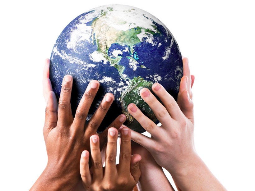 Many young hands support Earth